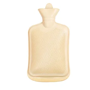 Beige rubber hot water bottle with anti-slip diagonal ribs for safe daily winter warming.