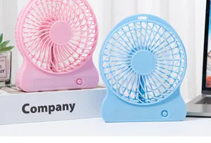 Detailed view of portable desktop USB rechargeable plastic mini fan in pink and blue colors.