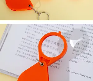 Llavero lupa plegable portátil con lente óptica transparente para lectura fácil.