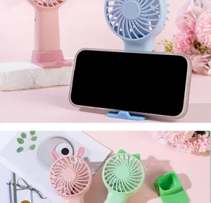 Mini handheld USB rechargeable fan detail view, desktop phone stand and cute animal ears design.
