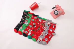 Detailed view of assorted Christmas mid-tube socks featuring cute holiday patterns and festive designs.