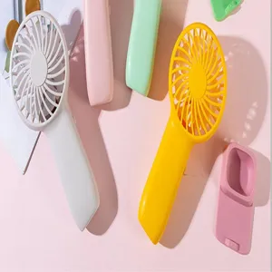 Portable mini USB handheld fan detail view showing colorful fan handles and desktop stand support.