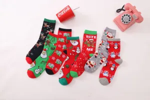 Christmas mid-tube cotton socks detail view featuring multiple cute holiday patterns.