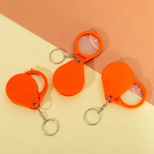 Lupa plegable portátil llavero mini lupa de bolsillo juego de tres piezas color naranja