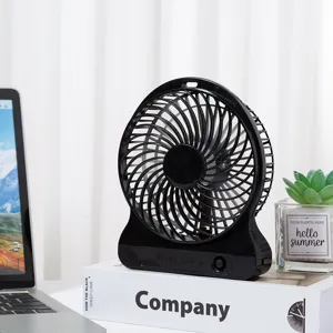 Portable mini USB desk fan in black, perfect for cooling desktop and bedside use.