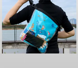 Transparent waterproof phone bag detail view, cute cartoon whale pattern, portable outdoor use.