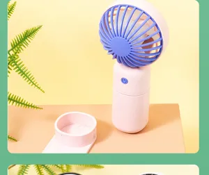 Mini ventilatore portatile ricaricabile USB vista dettagliata in blocco di colori rosa e viola.