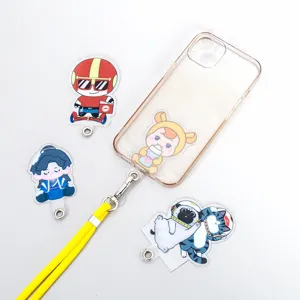Crossbody phone case strap set with cute cartoon acrylic charms and clear phone case.