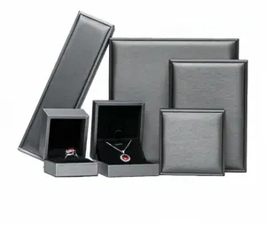 Various sizes of grey brushed PU leather jewelry boxes for rings and necklaces