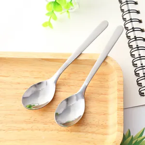 Stainless steel long handle stirring spoon detail shot showing glossy finish and shape.