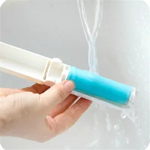 Washable sticky lint roller for clothes, reusable pet hair remover brush with foldable handle.