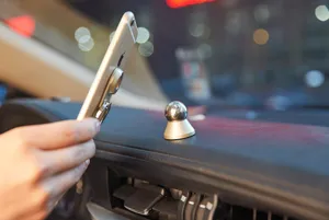 Universal car phone mount magnetic dashboard holder with metal ring grip for easy mobile navigation.