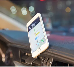 Detail view of the durable metal car phone mount securely attached to the vehicle dash.