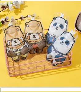 Detailed view of cute cartoon animal hot water bags in a pink basket, perfect for hand warming.