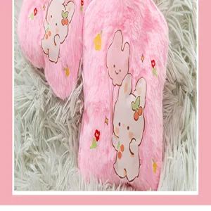 Cute pink plush hot water bag cover with cartoon rabbit print, thick and warm for winter.