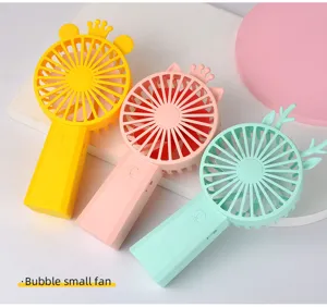 Handheld mini electric fan cute cartoon portable small fan with colorful animal designs.