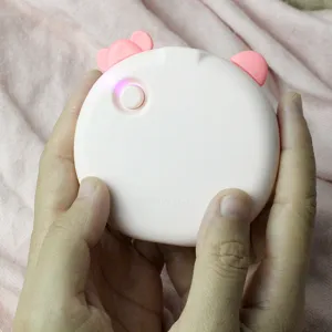 Cute Hello Kitty USB rechargeable hand warmer and glowing mirror in pink, portable winter gift.