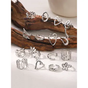 Detailed view of trendy stainless steel open rings set featuring chic hollow floral and heart designs.