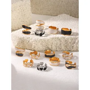 Detailed view of trendy irregular titanium steel oil drop rings, chic open geometric jewelry.