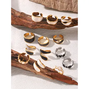 Trendy irregular titanium steel oil drop open rings set, chic minimalist fashion jewelry design.