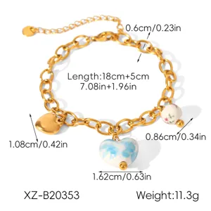 Gold stainless steel ceramic heart bracelet with extension chain, fashion jewelry for women.