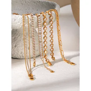 Gold titanium steel layered bracelets set featuring sparkling clear cubic zirconia stones for women.