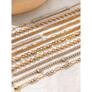 Detailed close-up of multiple gold layered stainless steel tennis bracelets with sparkling zirconia.