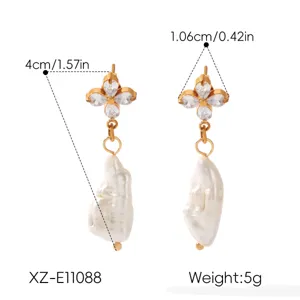 French vintage freshwater pearl earrings featuring sparkling flower zircon stud detail.