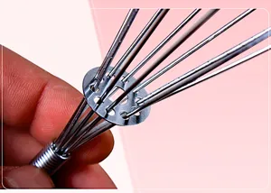 Stainless steel manual spring whisk for effortless egg beating and baking in kitchen cooking.