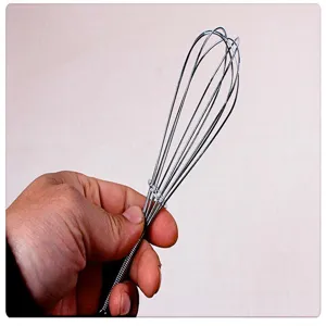 Stainless steel manual spring handle whisk detail view, perfect for kitchen baking eggs.