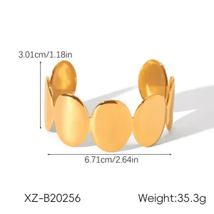 Exaggerated gold stainless steel open cuff bracelet featuring stylish interlocking oval designs.