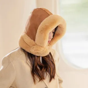 Warm women's suede integrated winter hat and scarf with thick plush trim for cold weather.