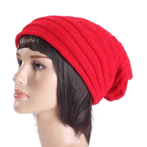 Detailed close-up view of the cozy red knitted slouchy beanie showcasing fine texture.