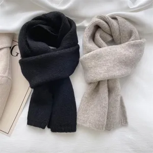 Soft cozy knit winter scarf detail view, minimalist solid color warm neck wrap for women.