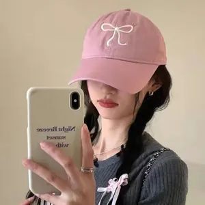 Pink baseball cap for women with cute white embroidered bow, sweet style adjustable hat.