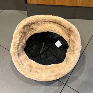Plush bucket hat inner detail view, thick winter warm fuzzy hat interior structure display.