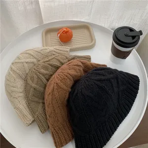 Detailed view of cozy chunky knit winter bucket hats in multiple solid colors for warm daily wear.