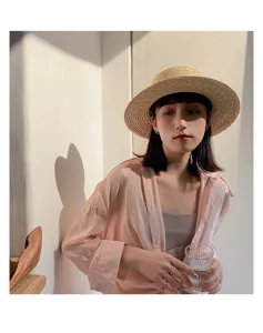 Stylish raffia straw sun hat for women, perfect for summer beach vacation and daily casual wear.