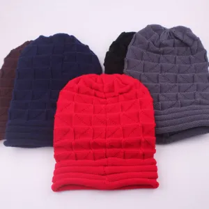 Detail view of the knit beanie showing the textured waffle pattern and folded cuff design.