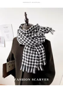 Classic black and white houndstooth tassel scarf detail, warm winter cozy fashion accessory.
