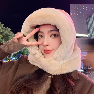 Close-up detail of the warm plush hooded scarf worn outdoors in winter night, cozy and soft.