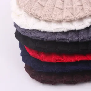 Detailed view of cozy pleated knit beanies in multi colors, perfect for cold winter days.