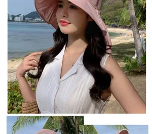 Detailed view of womens summer pink hollow breathable sun hat beach outdoor wear.