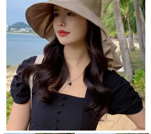 Detailed view of women's hollow breathable large brim beach sun hat in khaki style.