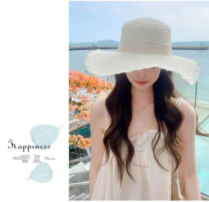Summer beach straw hat with bow and wide brim, stylish UV protection hat for outdoor travel.
