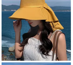 Summer hollow breathable sun hat with wide brim and bow for beach and outdoor travel.