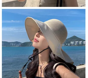 Outdoor beach sun hat detail showcasing breathable hollow mesh design and wide brim structure.