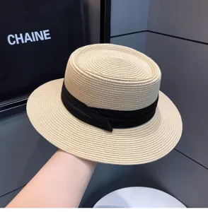 Summer straw boater hat for women, vintage flat top sun hat with black ribbon.