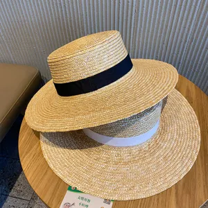 Women flat top straw hat summer beach sunshade woven hat with elegant ribbon design.
