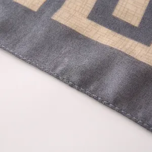 Close up of winter cotton linen feel geometric pattern scarf detail, soft fabric texture.